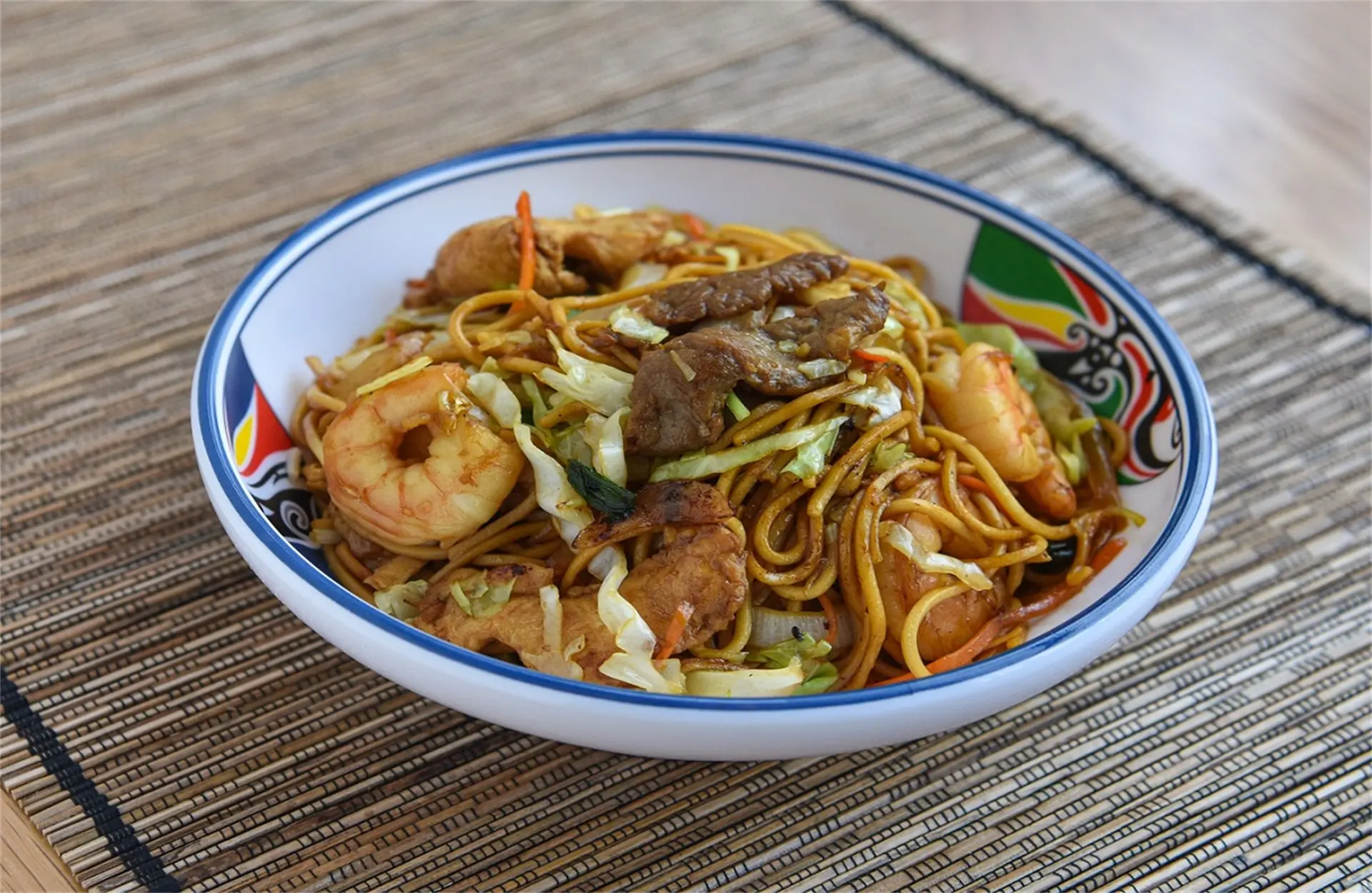 Stir-fried noodles with shrimp, beef, and veggies at Tang Wok, a Chinese Restaurant in Miami