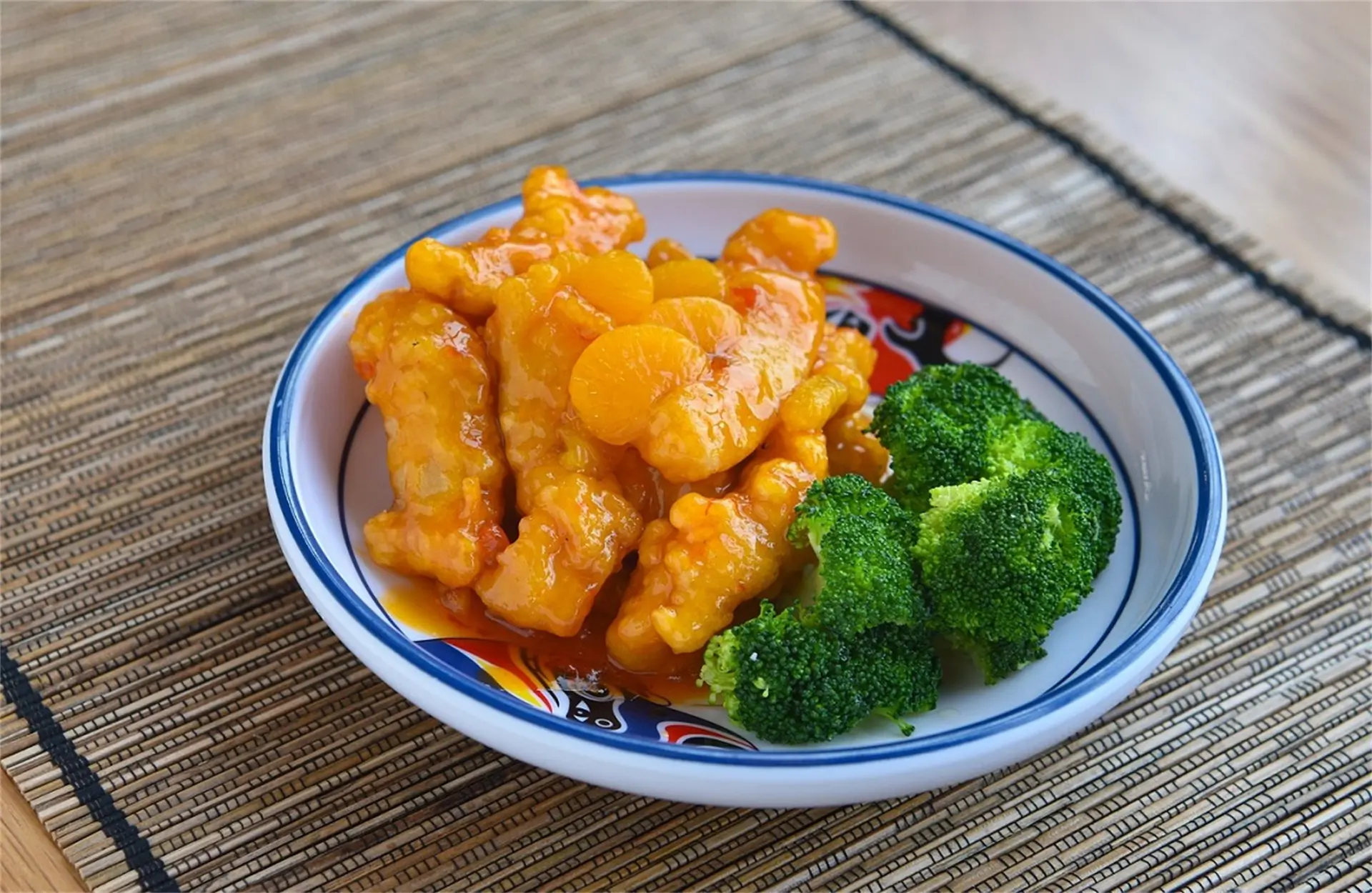Sweet and tangy orange chicken with broccoli at Tang Wok, a Chinese Restaurant in Miami